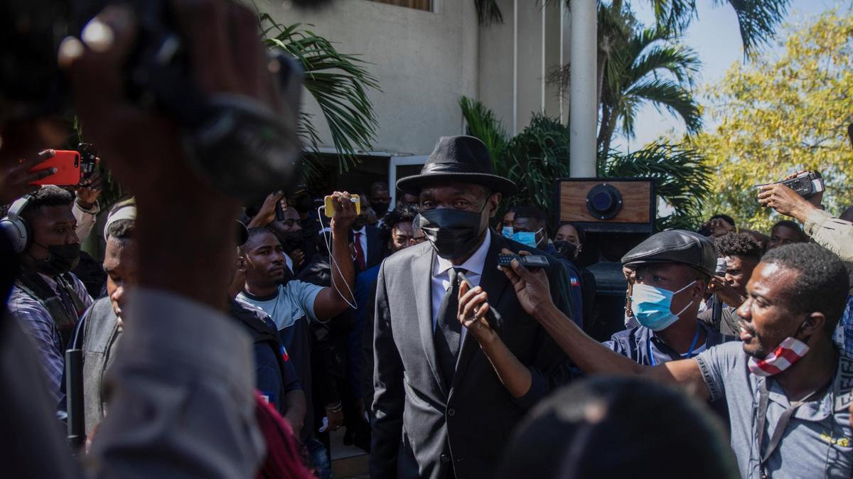 Senate President Joseph Lambert, center, arrives for a press conference at the Senate chambers in Port-au-Prince, Haiti, Monday, Jan. 10, 2022. Along with former Senate President Youri Latortue, he was recently sanctioned by the U.S. government.