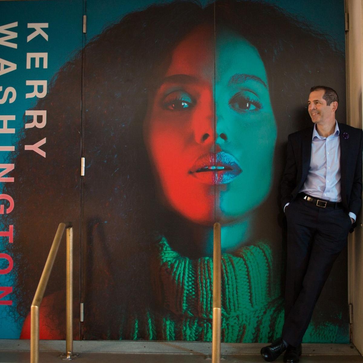 Miami playwright Christopher Demos-Brown stands alongside the portrait of “American Son” star Kerry Washington at Broadway’s Booth Theatre.