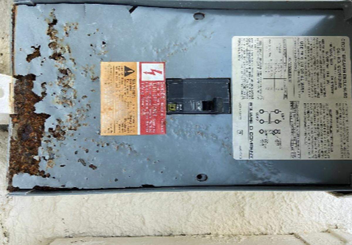 A photo from inspectors with Cueto Engineering shows a corroded electrical box at Mariner Place apartments in the Middle Florida Keys city of Marathon.