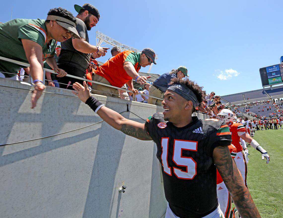 Miami Hurricanes quarterback Jarren Williams (15) greets fans after the Miami Hurricanes 2019 spring game at Camping World Stadium in Orlando. Williams will make his first start in the season opener against the Florida Gators at the same site on Saturday, Aug. 24, 2019.