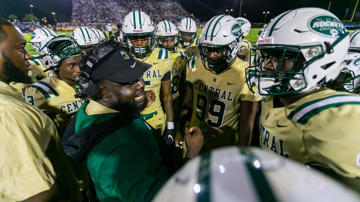 Miami Central assistant coach Jube Joseph talks to his players as they face the Northwestern Bulls during a football game on Friday, October 1, 2021 at Nathaniel Traz Powell Stadium in Miami, Florida.