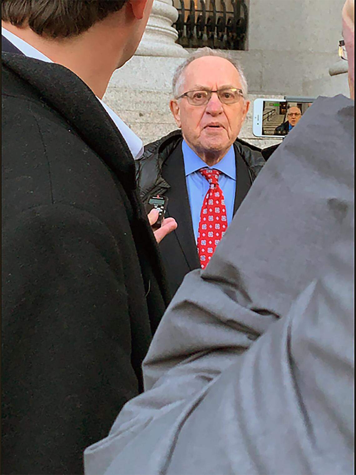 Attorney Alan Dershowitz speaks outside federal court in New York on Wednesday, March 7, 2019, after a hearing on whether to unseal documents from a civil case involving his friend and former client, Jeffrey Epstein.