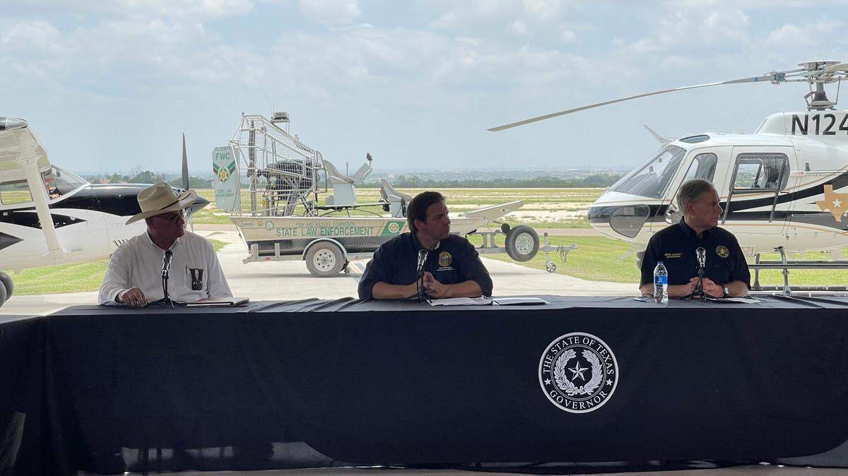 Florida Gov. Ron DeSantis and Texas Gov. Greg Abbott hold a press conference in Del Rio, Texas, to talk about a three-week effort by a contingent of Florida law enforcement officers to help enforce the U.S.-Mexico border.