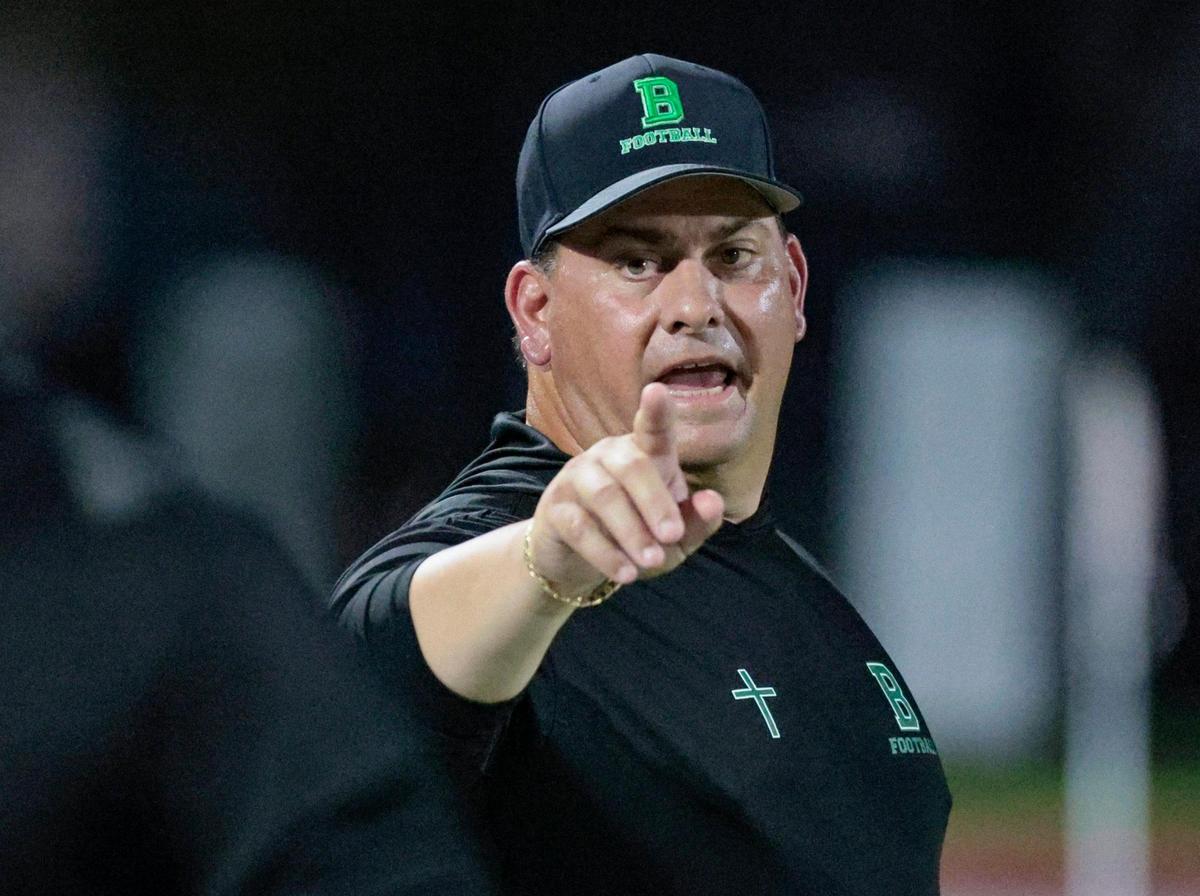St. Brendan coach Stephen Smith works the sidelines during game against Westland Hialeah at St. Brendan High School on Friday, October 14, 2022.