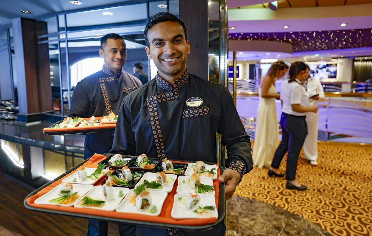Adiya serves sushi at the new Kaito Sushi restaurant on MSC Poesia at PortMiami in Miami, Florida, on Wednesday, April 22, 2026. Built in 2008, it underwent refurbishment this year. This winter, it will be based at PortMiami heading on trips to the Caribbean. Bar