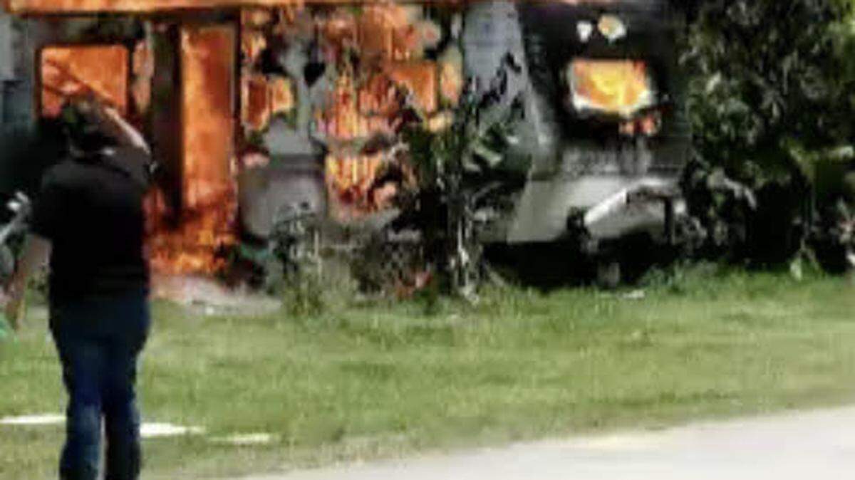 Flames destroy a trailer in the Florida City Campsite and RV Park Thursday, May 13, 2021. A man who was inside later died after Miami-Dade Fire Rescue took him to the hospital.