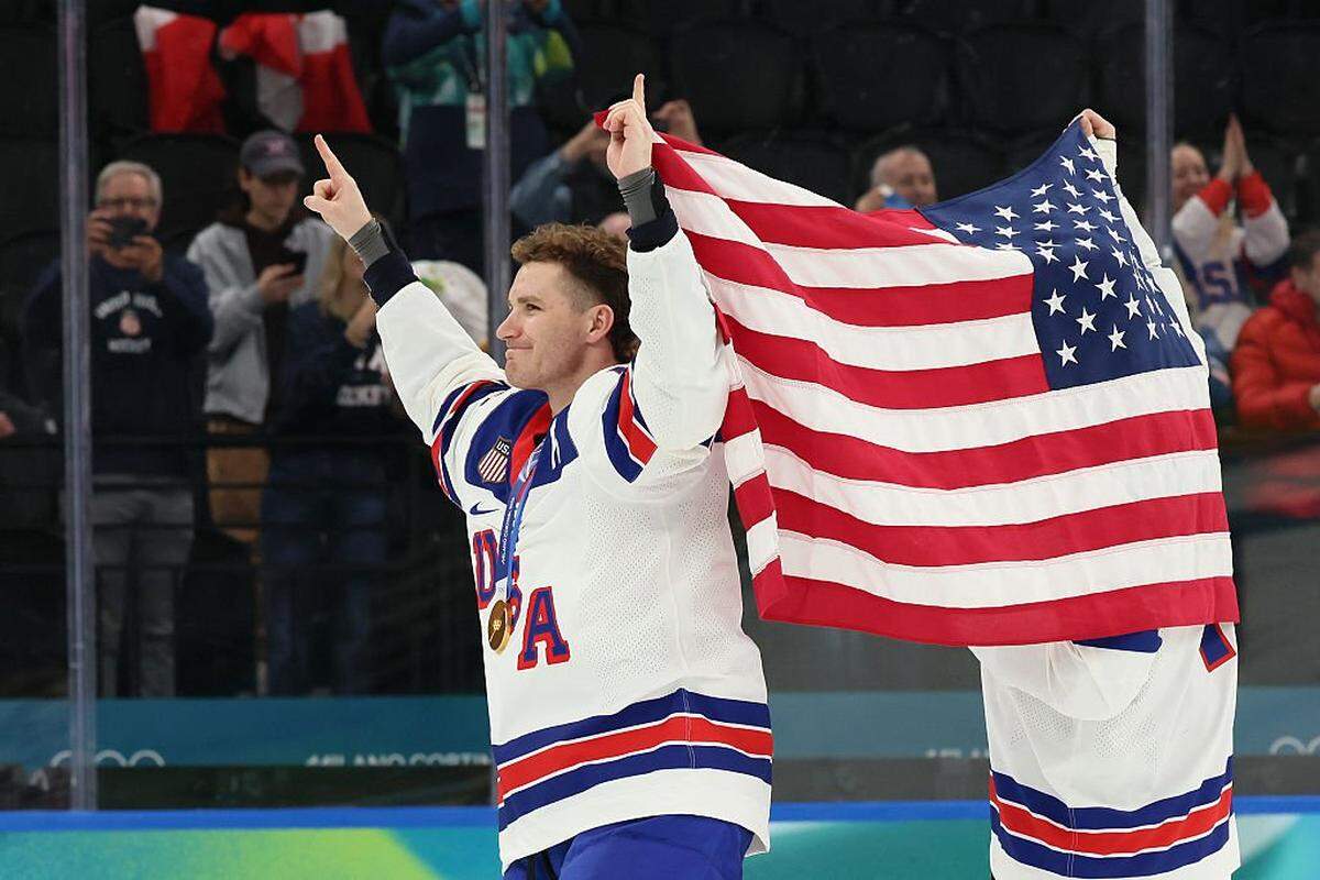 MILAN, ITALY - FEBRUARY 22: Gold medalists Brady Tkachuk #7 and Matthew Tkachuk #19 of Team United States celebrates after the medal ceremony for Men's Ice Hockey following the Men's Gold Medal match between Canada and the United States on day 16 of the Milano Cortina 2026 Winter Olympic games at Milano Santagiulia Ice Hockey Arena on February 22, 2026 in Milan, Italy. (Photo by Bruce Bennett/Getty Images)