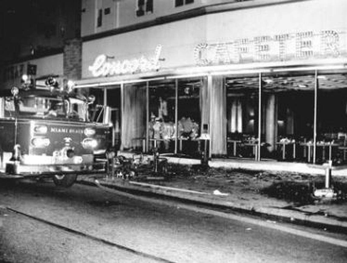 Firefighters search the debris of the Concord Cafeteria.