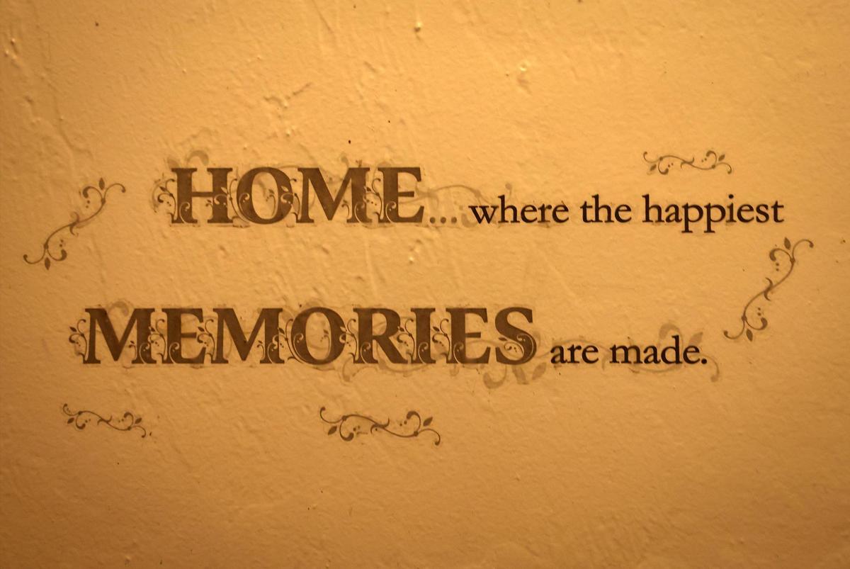A small reminder of the importance of home is displayed between two bedrooms.
