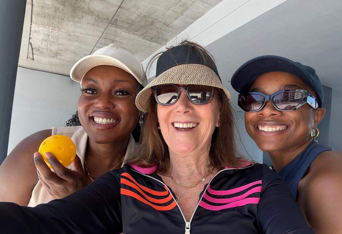 Carolyn Glickstein with two of her students after a pickleball lesson.