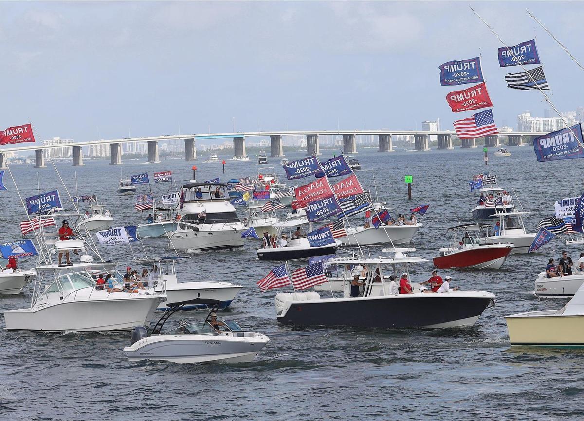 Pro Trump boaters gather just north of the Venetian Causeway while waiting for the draw bridge to be upright and continue south toward the Bayfront Park shoreline in a show of support two days prior of the presidential election on Sunday, November 1, 2020 in Miami, Florida.
