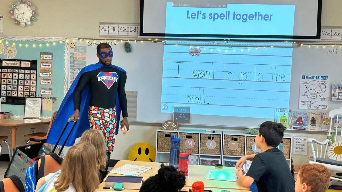 John Cesar is the community engagement coordinator for the Children's Services Council of St. Lucie County who also is known by his alter ego, "Bookman," taken Jan. 29, 2025, in Port St. Lucie, Florida.