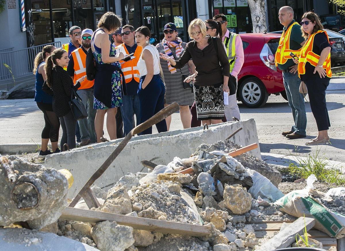 Miami-Dade Commissioner Eileen Higgins, center, complains about disruptions on Flagler Street as she tours the construction site near Ninth Avenue with state officials on Tuesday, Nov. 20, 2018.