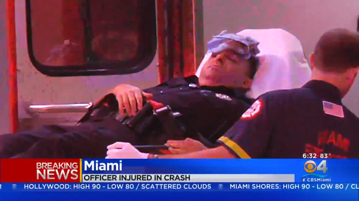 The Miami police officer, whose identity has not been released, was taken to Jackson Memorial Hospital for a head injury.