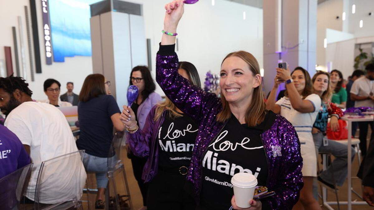 Miami Foundation President and CEO Rebecca Fishman Lipsey celebrates during Give Miami Day 2024 at the Royal Caribbean terminal at PortMiami.