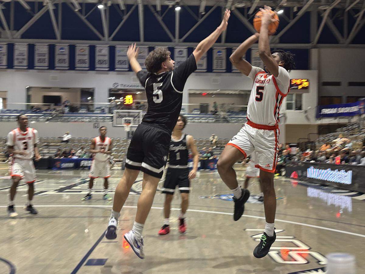 Sagemont’s Obinna Ekufu (right) shoots a jumper during Thursday's Class 1A state semifinal at UNF Arena in Jacksonville, Fla.