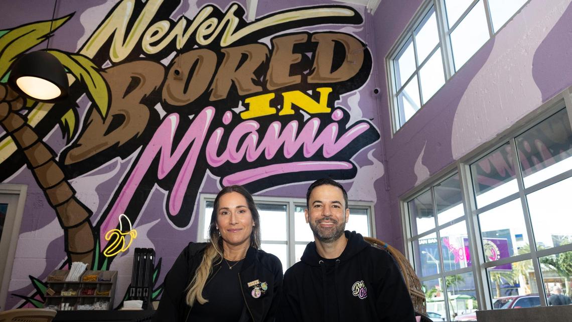 Kali and Eric Castellanos, owners of Bored Cuban, inside the new fast-casual restaurant in Miami. The photo-friendly mural was painted by local artist Friks84.