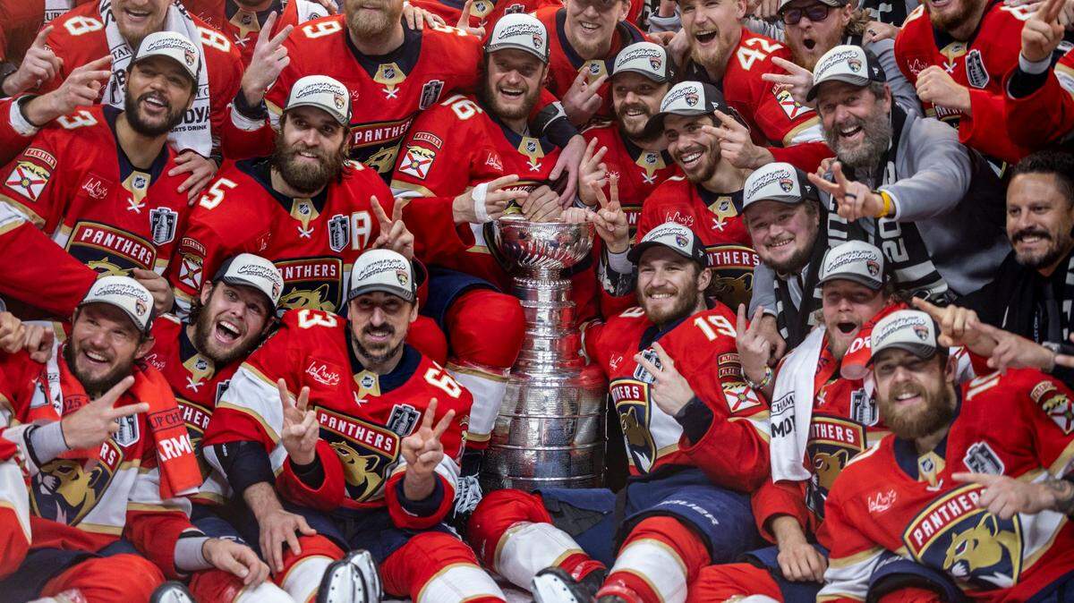 Florida Panthers pose with the  Stanley Cup after the Panthers defeated the Edmonton Oilers in Game 6 