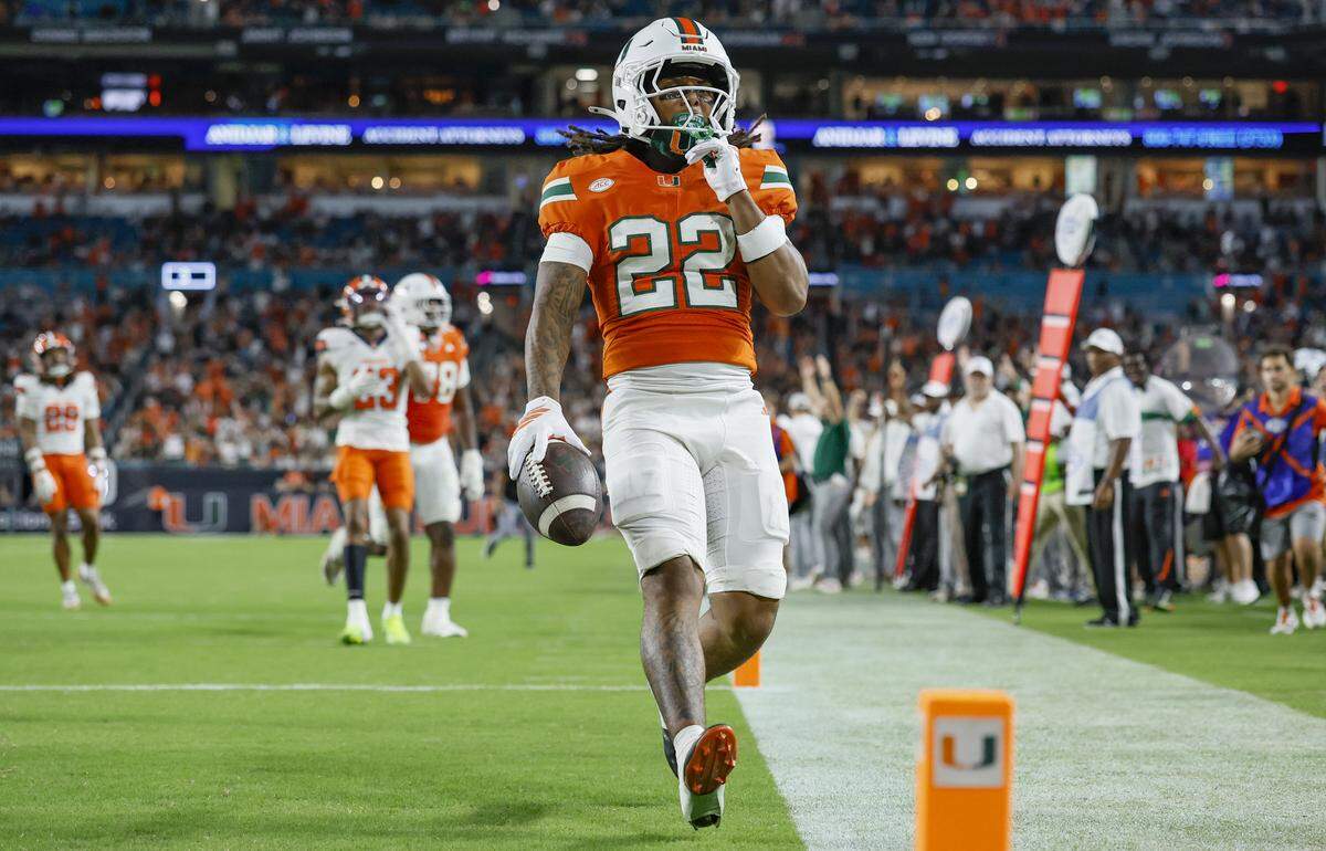 Miami Hurricanes running back Girard Pringle Jr. (22) scores in the second half of an NCAA football game against the Syracuse Orange at Hard Rock Stadium in Miami Gardens, Florida on Saturday, November 8, 2025.
