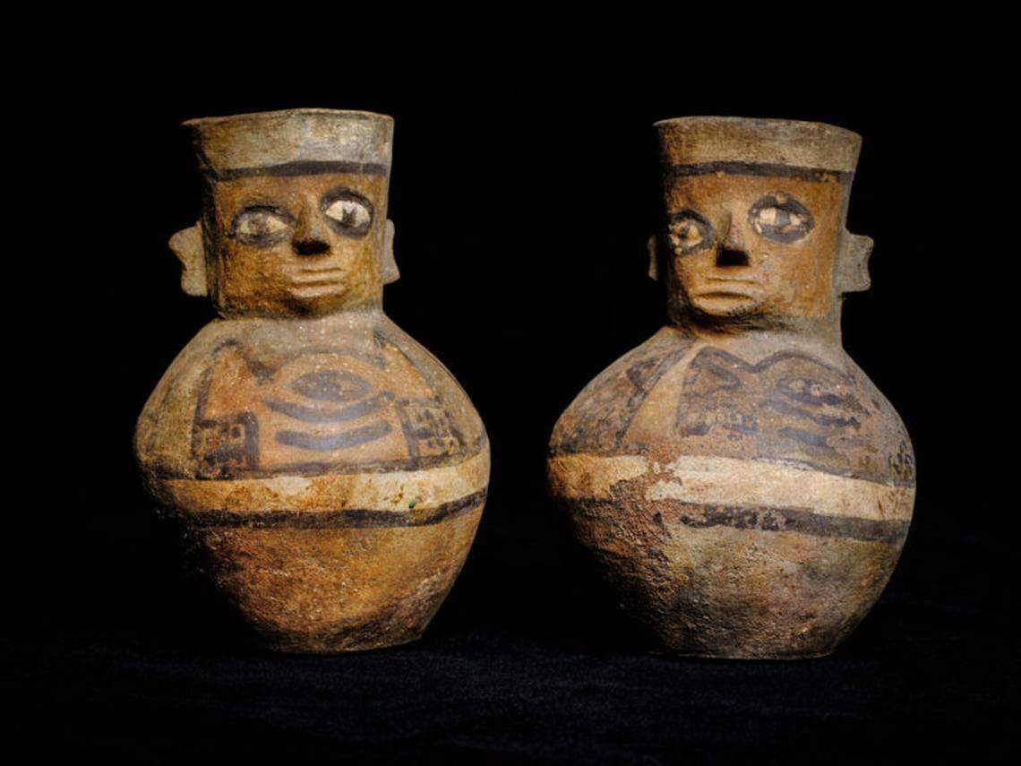 A pair of miniature jugs that were found in a grave setting.