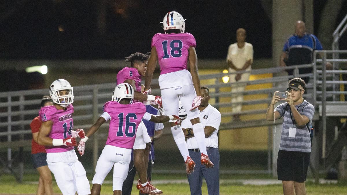 Chaminade-Madonna College Preparatory wide receiver Elijah Canion (18) celebrates with teammates after scoring a touchdown during the first quarter of a game against the Booker T. Washington Senior High School Tornadoes at Curtis park in Miami, FL, on October 12, 2018.