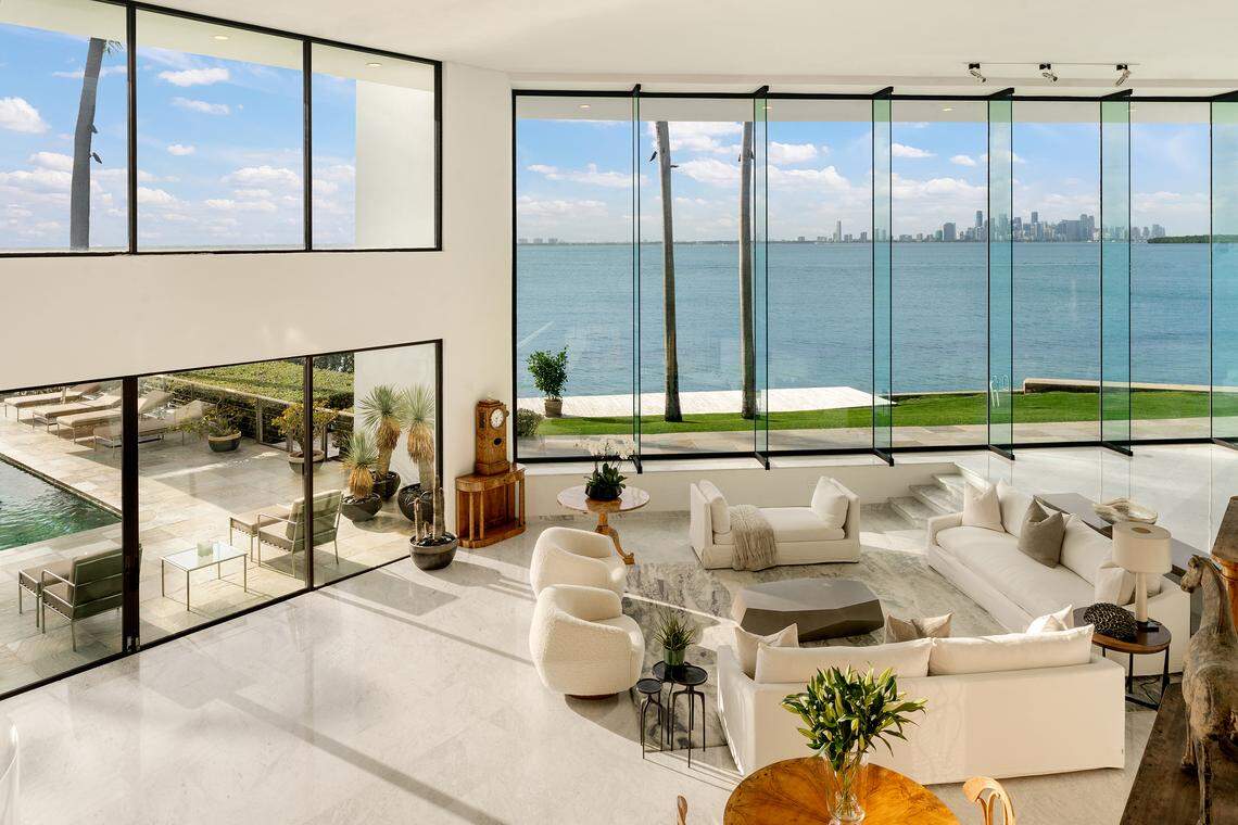 The home’s living room boasts expansive views of the Miami skyline across Biscayne Bay.