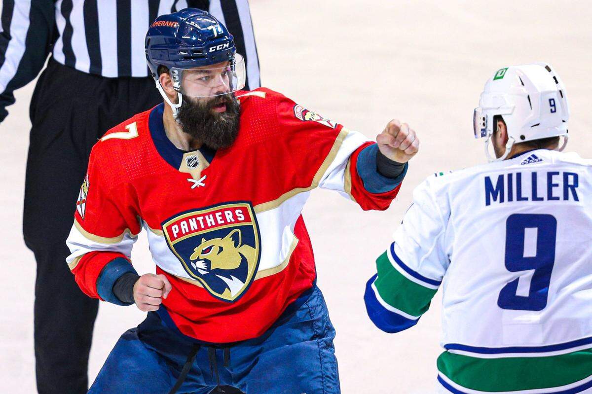 Florida Panthers defender Radko Gudas (7) squares up against Vancouver Canucks center J.T. Miller (9) during the first period of an NHL game at FLA Live Arena in Sunrise, Florida, on Tuesday, January 11, 2022.