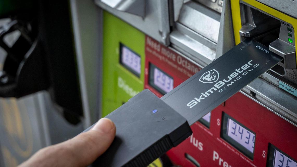 Miami, FL, July 23, 2025 - A U.S. Secret Service Agent ,uses a Skim Buster to detect the presence of a Credit Card Skimming device in the card reader of a gas pump at a gas station in Hialeah, Florida. The Secret Service is conducting an operation in Miami this week aimed at combatting EBT fraud and illegal ATM point-of-sale payment card skimming. They will be going around to different businesses and informing them about the scams.
