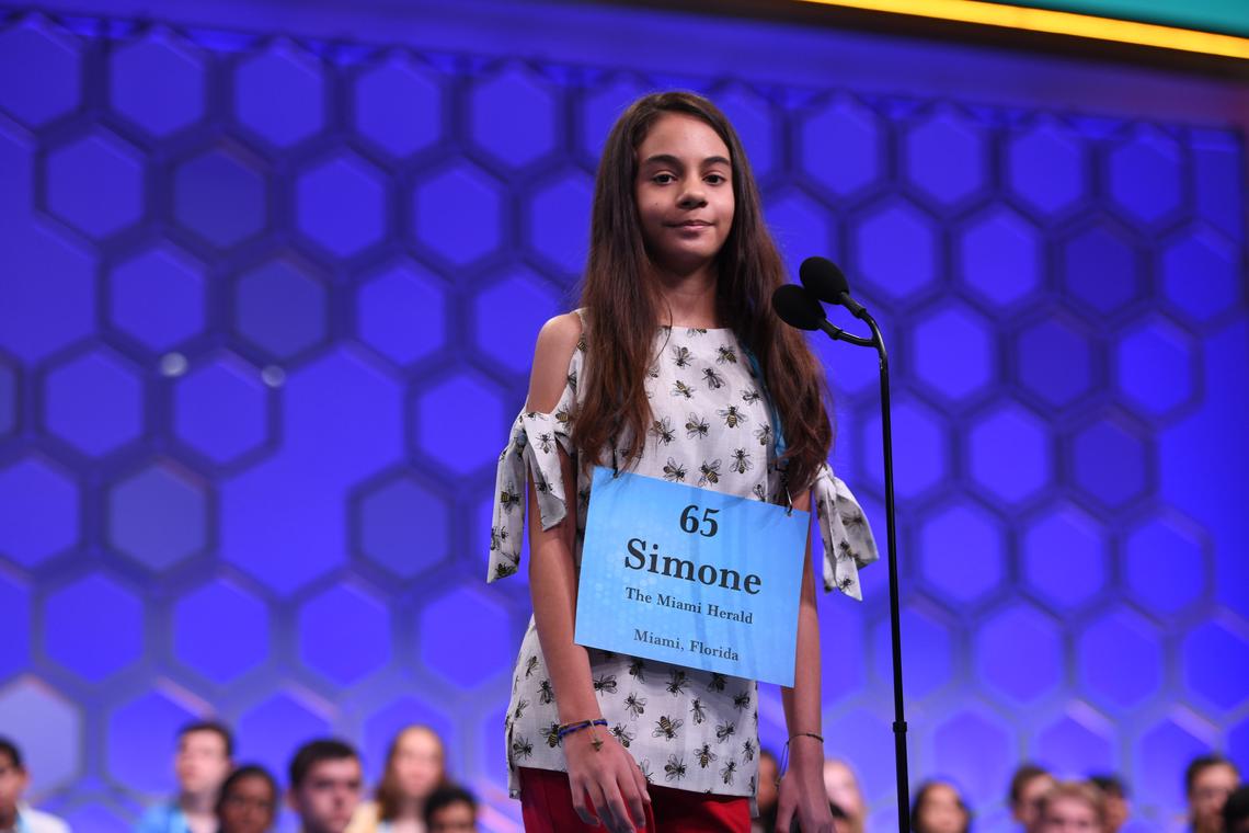 Simone Kaplan, 13, a seventh grader at St. Bonaventure Catholic School in Davie, spells her word correctly in Thursday’s first part of the final round in the Scripps National Spelling Bee in National Harbor, Maryland. She was one of 16 finalists in the final round.