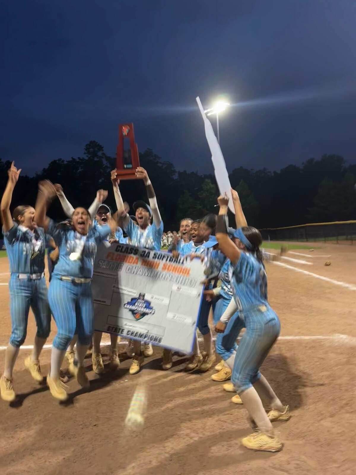 Somerset Silver Palms players celebrate following a 12-2 win over Eustis which clinched their first ever state title.