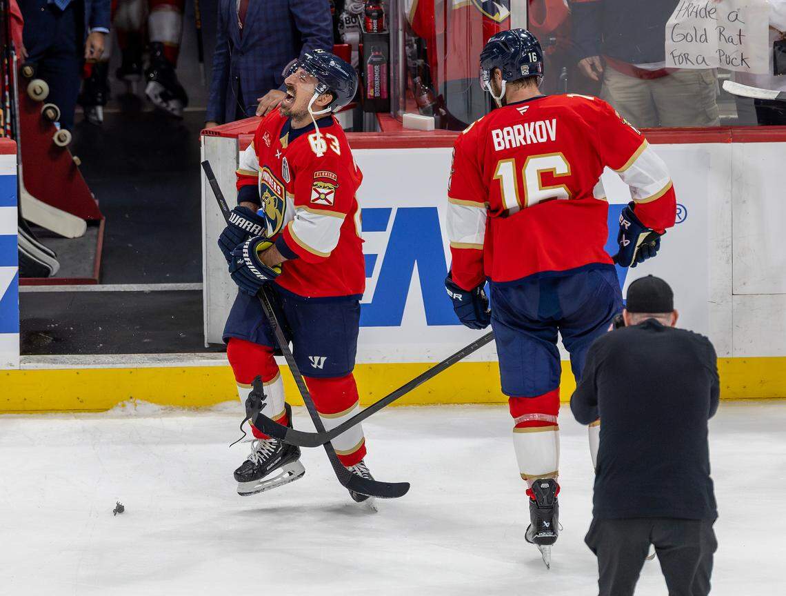Florida Panthers center Brad Marchand (63) reacts as teammate Aleksander Barkov (16) hit him with plastic rats after their 6-1 victory over the Oilers in Game 3 of the NHL Stanley Cup Final at Amerant Bank Arena on Monday, June 9, 2025, in Sunrise, Fla.
