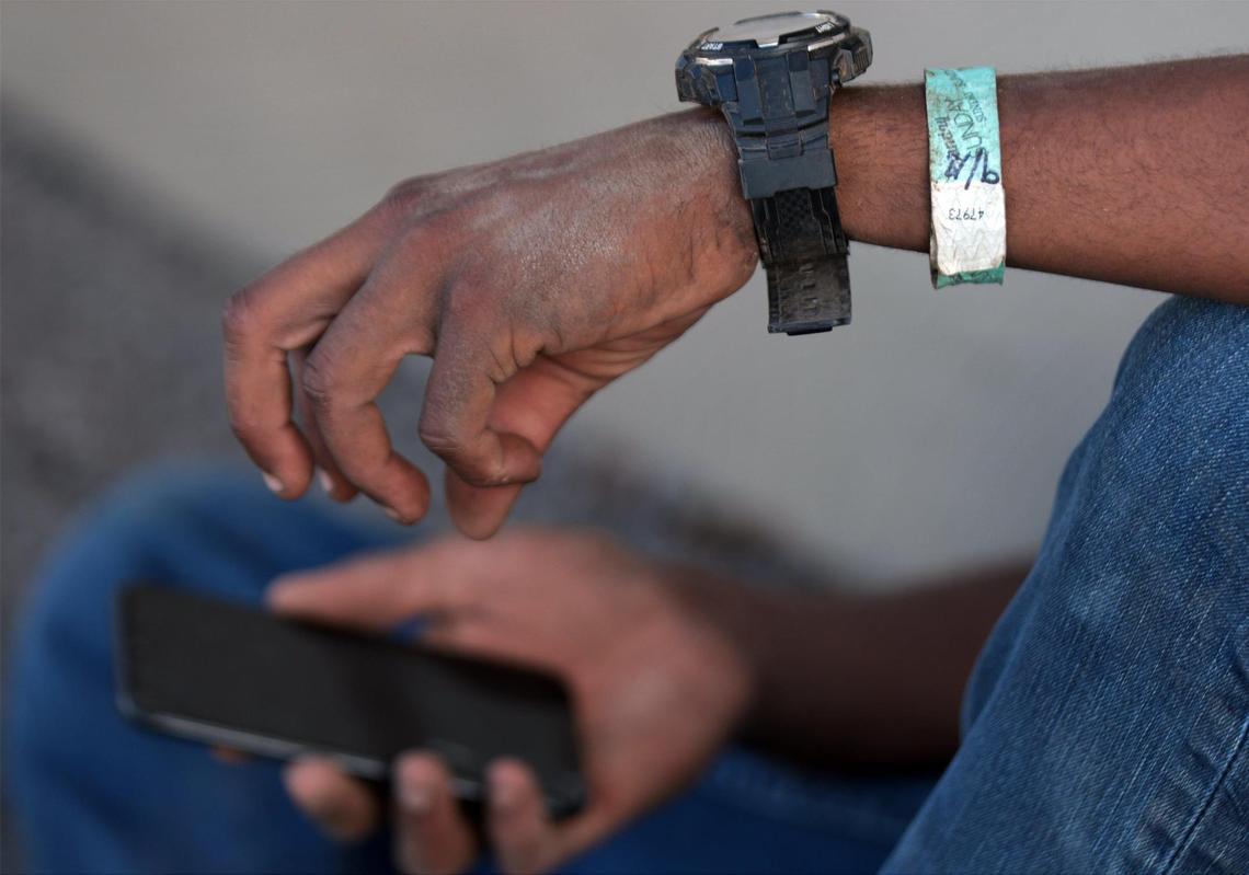 On Tuesday, September 20, 2022 Venezuelan migrant Irwign Gutierrez, 28, waits to be transported back to the Migrant Resource Center, where he has been staying since Monday, September 19th, after spending the day landscaping in dress shoes, jeans, and a-once-white t- shirt. Gutierrez has decided to stay in San Antonio to build a new life while working as a day laborer in order to earn a living.