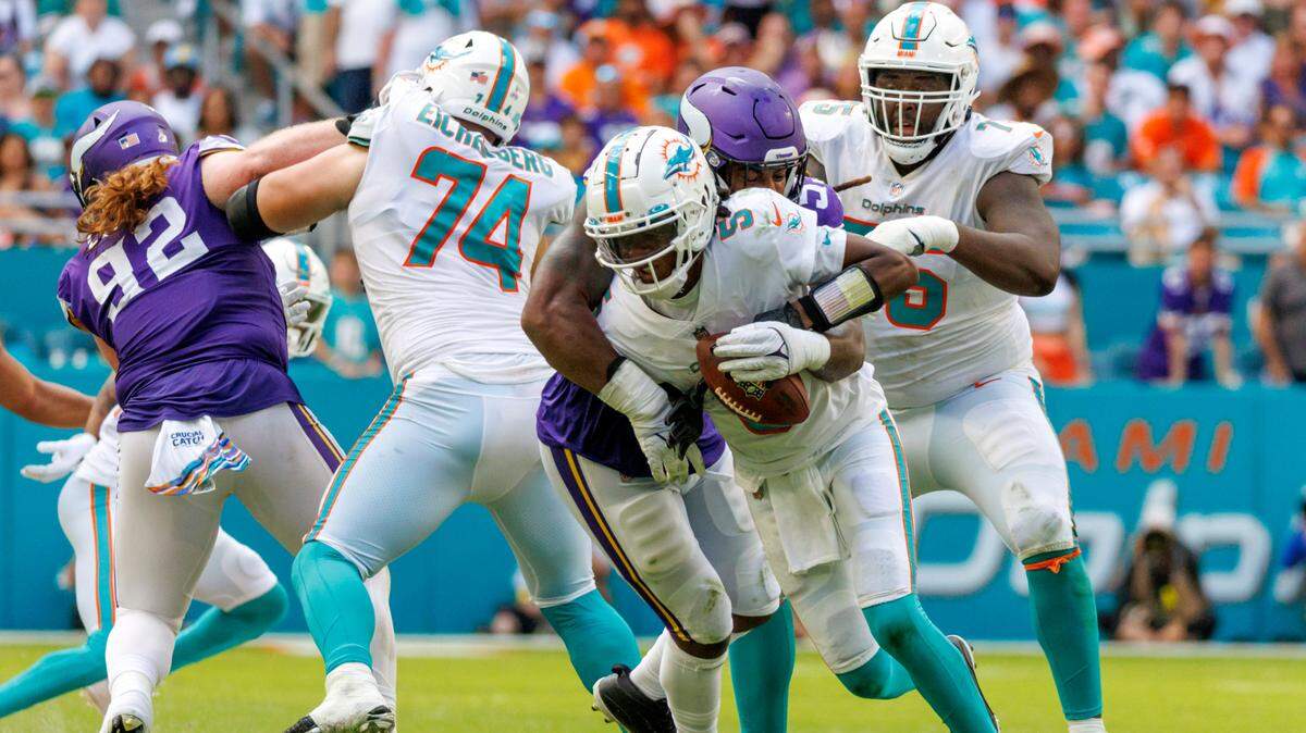 Miami Dolphins quarterback Teddy Bridgewater (5) is sacked by Minnesota Vikings linebacker Za’Darius Smith (55) during fourth quarter of an NFL football game at Hard Rock Stadium on Sunday, October 16, 2022 in Miami Gardens, Florida.