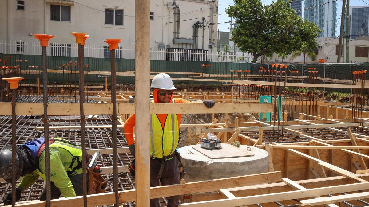 Construction workers work on the foundation of “Project Peach” as the Omni CRA held a groundbreaking for the development of a mixed-use affordable housing project in Overtown on Thursday, May 30, 2024, in Miami.