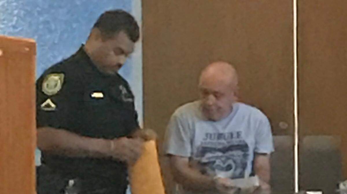 A Monroe County Sheriff’s Office deputy takes fingerprints from Roberto Larias De Leon at the Plantation Key courthouse on Tuesday, March 12, 2019.