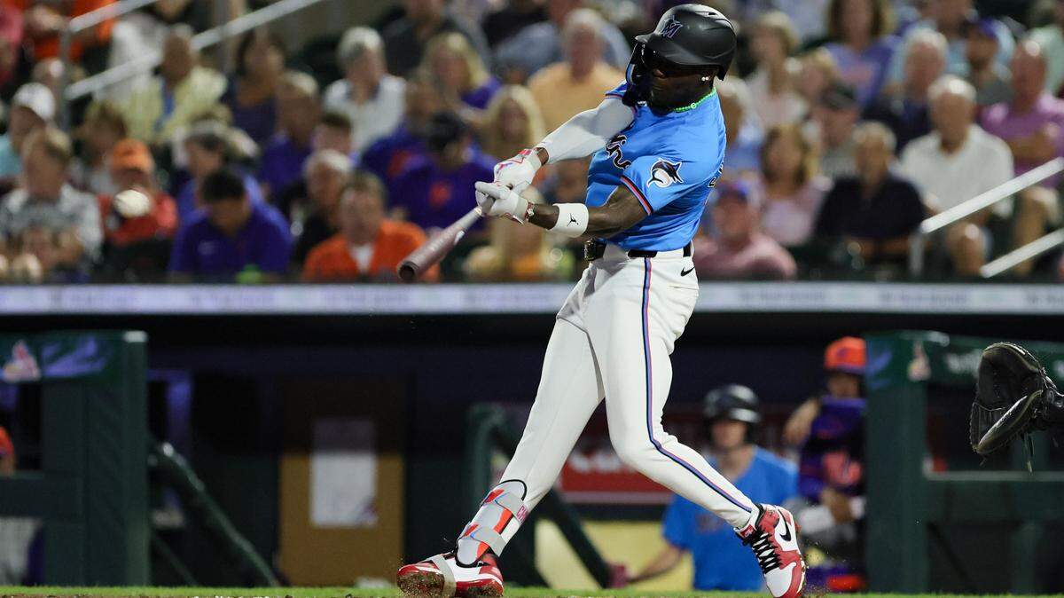 Mar 8, 2024; Jupiter, Florida, USA; Miami Marlins center fielder Jazz Chisholm Jr.(2) hits a single against the New York Mets during the fourth inning at Roger Dean Chevrolet Stadium. Mandatory Credit: Sam Navarro-USA TODAY Sports