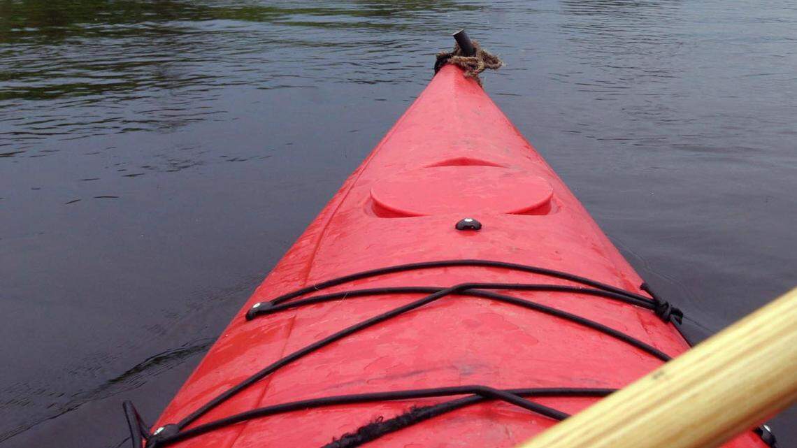 File photo of a paddler on a river. Authorities say a man fishing from a canoe drowned while swimming to shore at Milton Three Pond in New Hampshire.