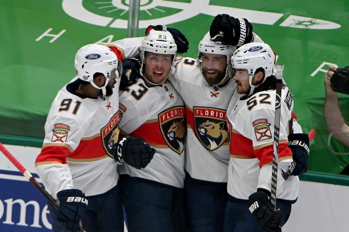 Florida Panthers left wing Anthony Duclair (91), center Carter Verhaeghe (23), defenseman Aaron Ekblad (5) and defenseman MacKenzie Weegar (52) celebrate after a Verhaeghe’s goal during the first period during an NHL hockey game against the Dallas Stars in Dallas, Saturday, March 27, 2021. (AP Photo/Matt Strasen)