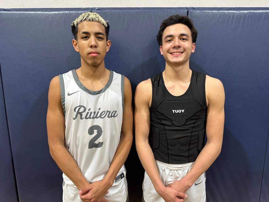 Riviera Prep guards Mason Fuentes (left) and Myles Fuentes (right) pose after their win over Hialeah Educational Academy on Tuesday at the Bulldogs’ home gym.