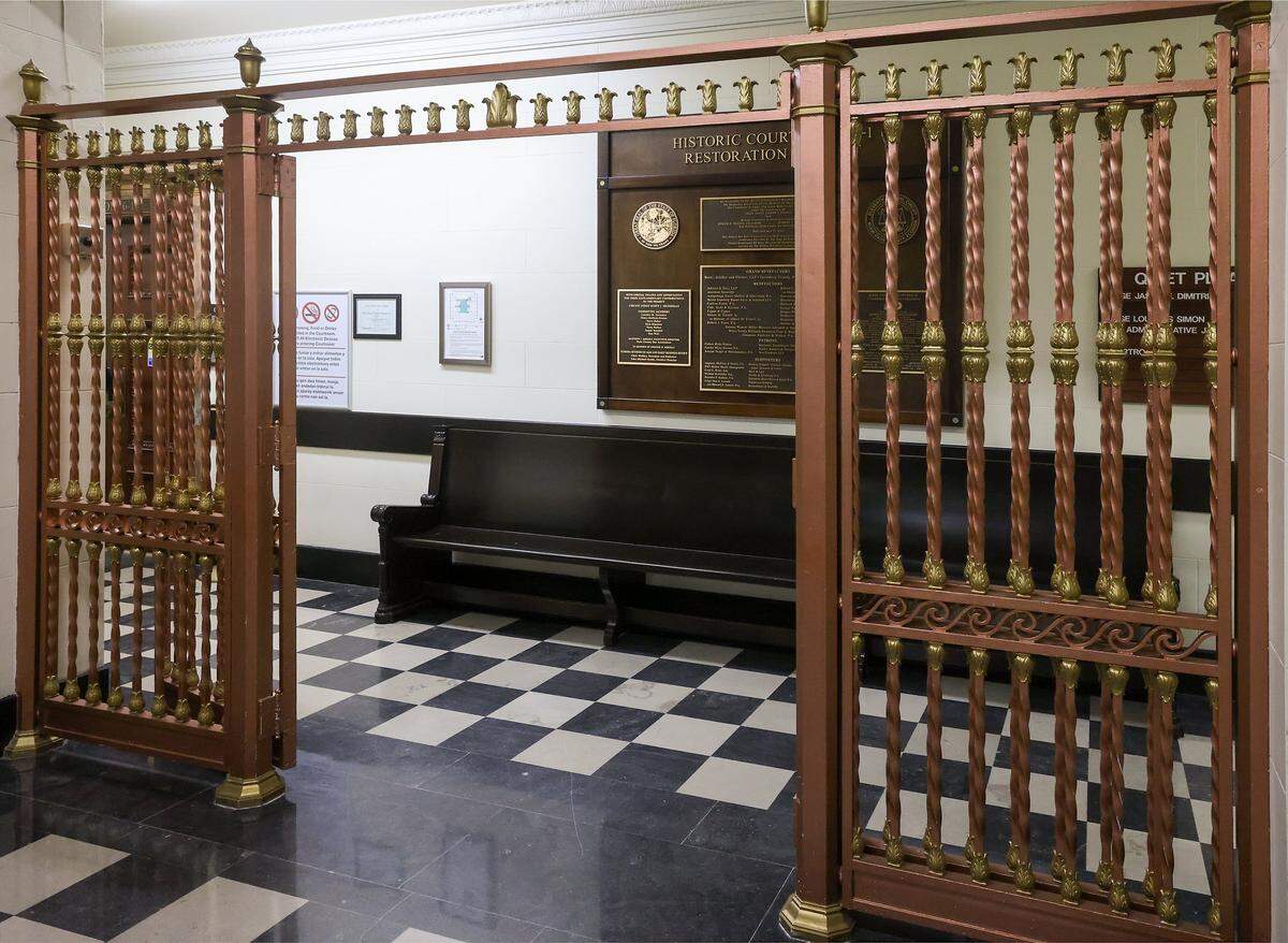 Iron panels separate the seating area from the courtroom hallways, is one of the historic elements repaired as part of restoration of the old courthouse in Miami, Florida, on Wednesday, January 14, 2026. The Dade County Courthouse is significant as an excellent example of Neo-Classical architecture. The detailing of the remaining historic interior spaces and features continue to reflect this distinctive style and contributes to a more complete understanding of the historic character of the Courthouse.