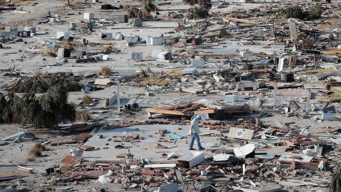 A man walks through a beachfront neighborhood six days after Hurricane Michael made landfall near Mexico Beach, Florida, on Oct. 10 as a Category 4 storm. The neighborhood, with homes lining the beach, is now mostly flattened.