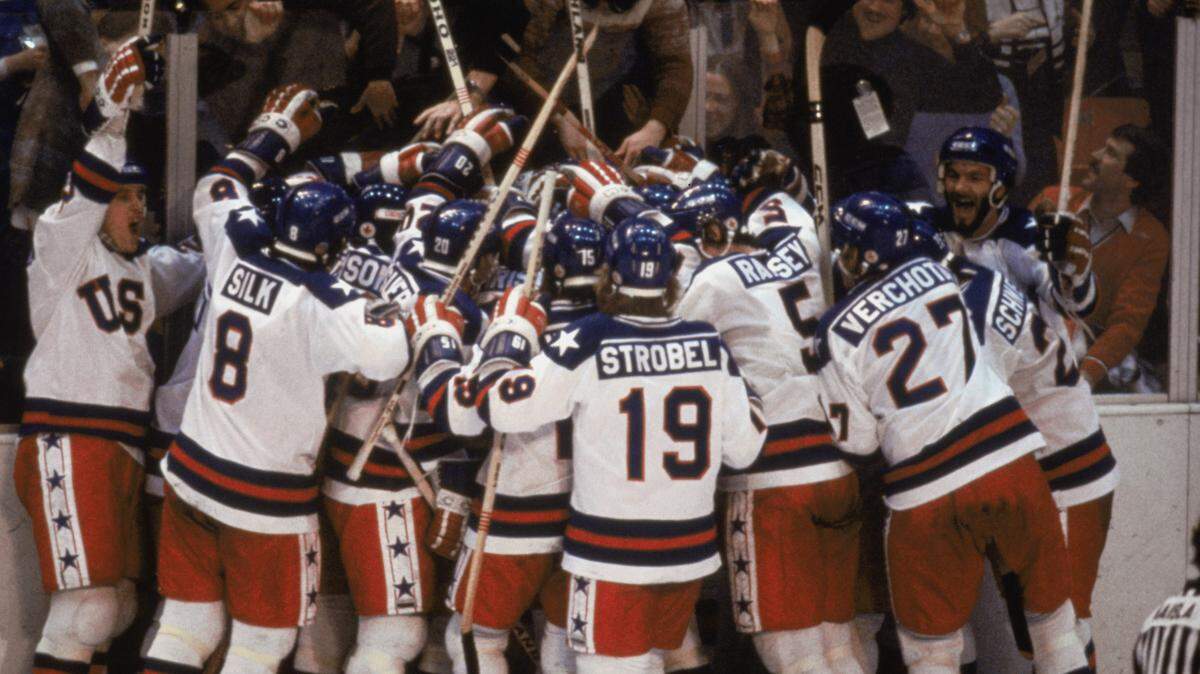 Team USA celebrates its 4-3 victory over the Soviet Union in the semi-final Men’s Ice Hockey event at the Winter Olympic Games in Lake Placid, New York on February 22, 1980. The game was dubbed “the Miracle on Ice”. The USA went on to win the gold medal by defeating Finland 4-2 in the gold medal game.