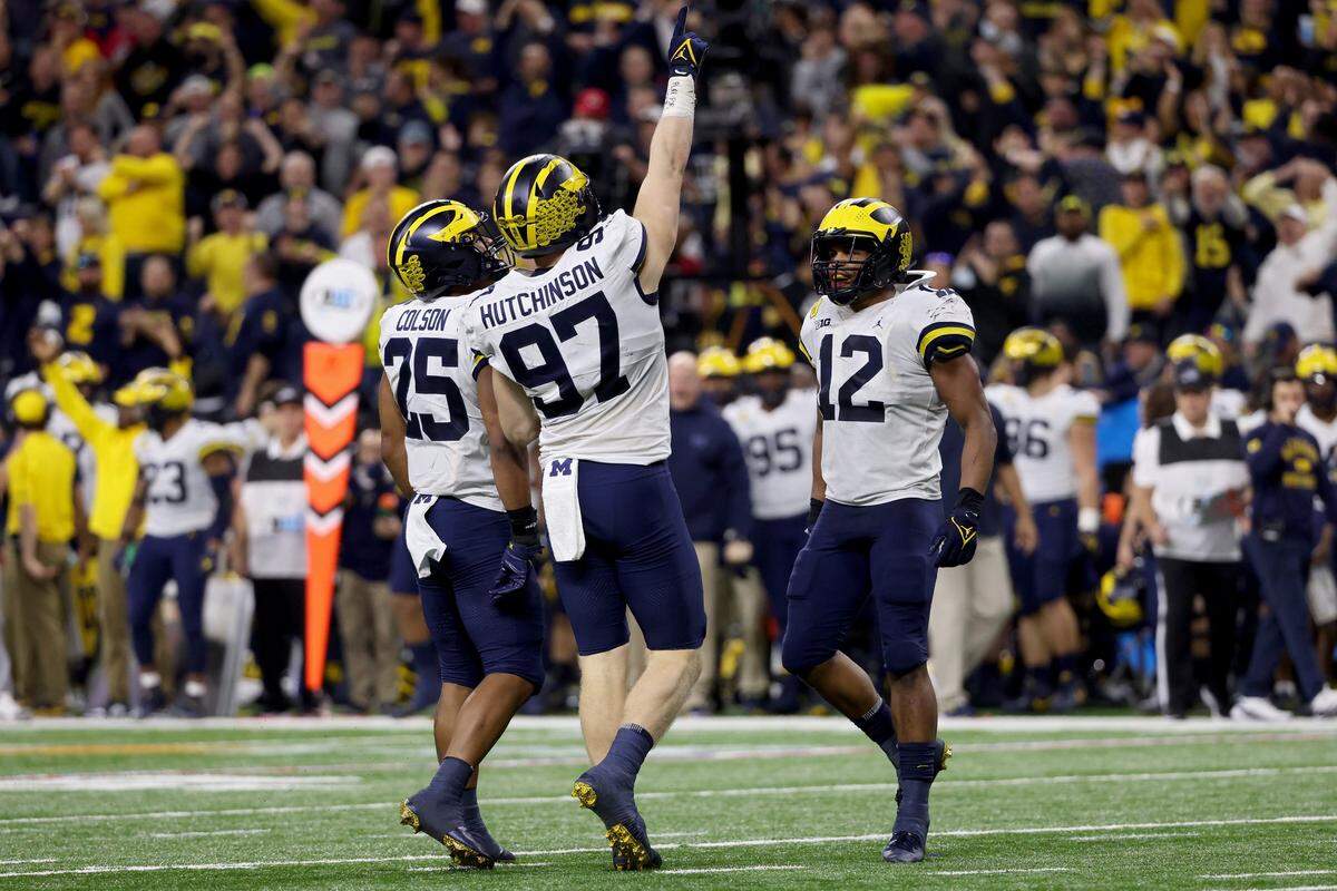 Aidan Hutchinson #97 of the Michigan Wolverines celebrates after recording a sack in the second quarter against the Iowa Hawkeyes during the Big Ten Championship at Lucas Oil Stadium on December 04, 2021 in Indianapolis, Indiana.