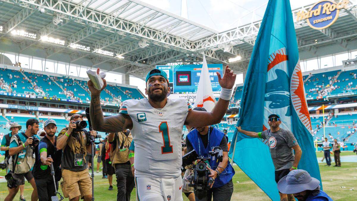Miami Dolphins quarterback Tua Tagovailoa (1) walks off the field after the Dolphins 31-17 win over the New England Patriots at Hard Rock Stadium on Sunday, Oct. 29, 2023, in Miami Gardens.