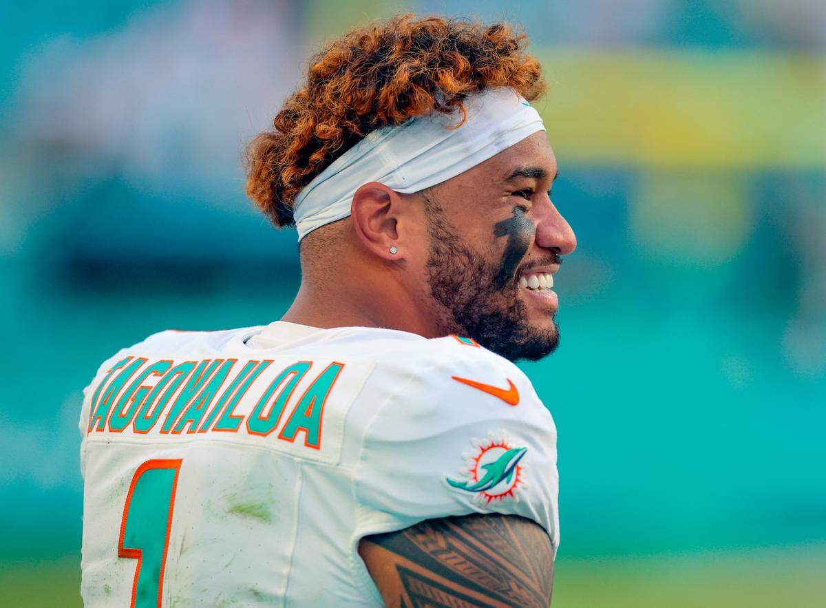 Miami Dolphins quarterback Tua Tagovailoa (1) on the sidelines in the second half of their NFL football game against the New England Patriots at Hard Rock Stadium in Miami Gardens, Florida, on Sunday, November 24, 2024. 