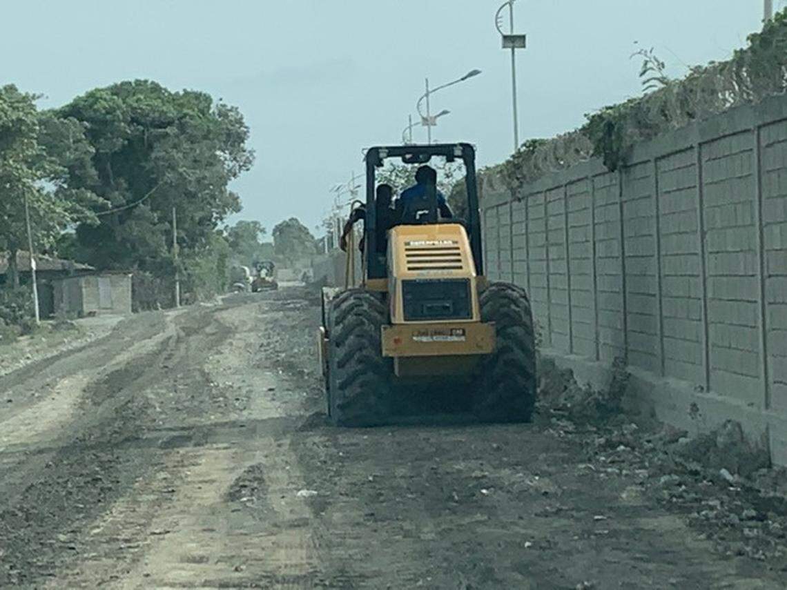 Workers prepare an unpaved road on Wednesday, July 21, 2021, for guests who will be attending the funeral of the late Haiti President Jovenel Moïse at his family’s walled-in residence on the outskirts of the northern port city of Cap-Haïtien, Haiti, on Friday, July 23.