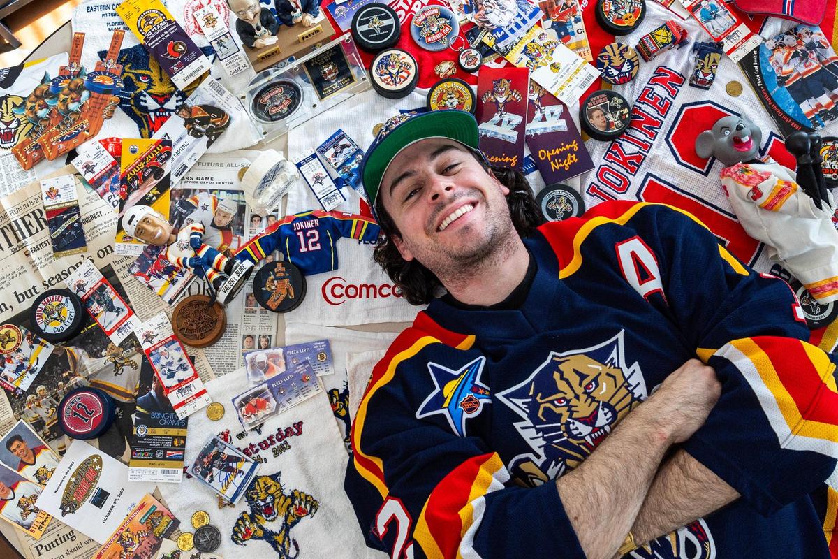 Life-long Florida Panthers fan Dillon Hearns lays down while surrounded by a fraction of the memorabilia and tickets he and his family collected since the inception of the Panthers as a franchise on Sunday, June 16, 2024, in Miami, Fla. Hearns played ice hockey growing up at Kendall Ice Arena where he was coached by both Bob Diamond and ‘Pops’ Wright