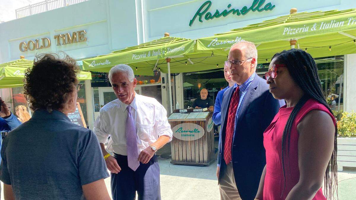 Gubernatorial candidate and U.S. Rep. Charlie Crist, D-St. Petersburg, (left) at a campaign stop in Miami Beach on Friday morning with Mayor Dan Gelber, speaking with local small business leaders.