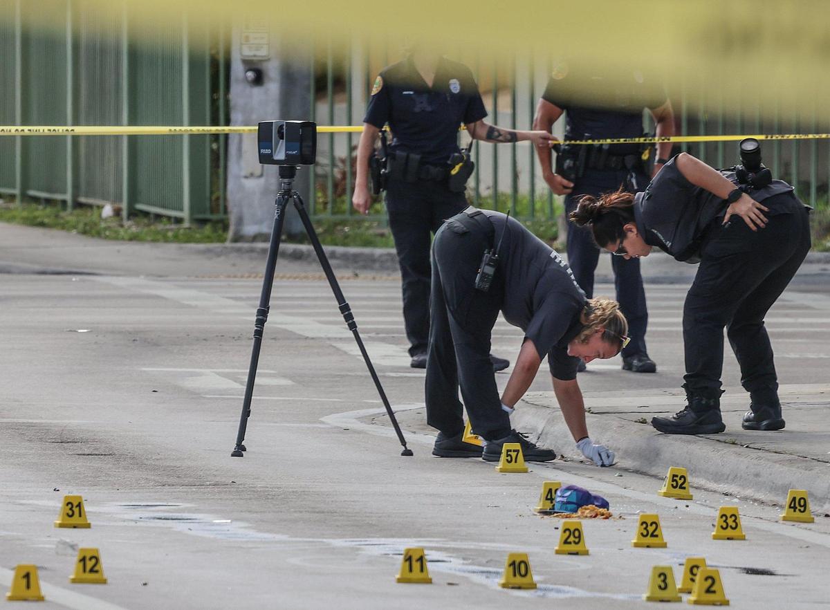 Miami police and crime scene Investigators work the scene where four people were shot, two of them killed, near the intersection of Northwest 62nd Street and Northwest Second Avenue in Miami on Monday, June 16, 2025.