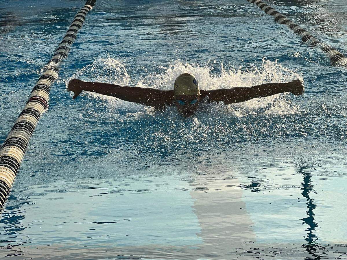 St. Thomas Aquinas senior Julianne McCranie competes in the 100 butterfly, where she finished first with a time of 56.07 and helped the Raiders win the BCAA swimming and diving title on Saturday at the Plantation Central Park Aquatic Complex.